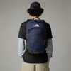 A person wearing a backpack from behind. Produktbild-Vorschau
