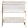 A baby bassinet with a storage basket underneath, shown against a white background. Produktbild-Vorschau
