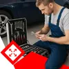 A mechanic in blue overalls is kneeling next to an open toolbox filled with tools, with a car in the background. Podgląd zdjęcia produktu