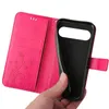 A hand holding a pink flip phone case, revealing the black interior. Produktbild-Vorschau