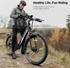 A man is standing next to an electric bicycle in an outdoor setting. Produktbild-Vorschau
