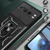 A close-up view of a black phone case with a ring stand and camera cover, placed on a textured surface with a green background. Produktbild-Vorschau