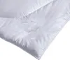A close-up view of a white duvet with an embossed pattern. Produktbild-Vorschau