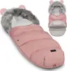 A pink baby sleeping bag with a faux fur hood and bear ears, shown from a slightly elevated angle. Produktbild-Vorschau