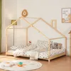 A child's bedroom with a wooden house bed, bedding, stuffed animals, and a rug.