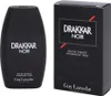 A black bottle of Drakkar Noir cologne and its matching black box packaging are displayed side-by-side against a white background. Náhled obrázku produktu