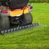 A lawn rake attachment for a ride-on mower is shown on a grassy field. Anteprima dell’immagine prodotto