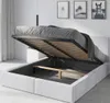 A bed with its storage compartment open, revealing the mattress support and storage space. Produktbild-Vorschau