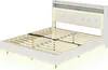 A white upholstered bed frame with a slatted mattress support and a headboard with built-in LED lighting and a shelf. Náhľad obrázku produktu