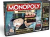 The image shows the box art for the Monopoly Banking Ultra board game, featuring Mr. Monopoly holding a bank card and a banking unit. Produktbild-Vorschau