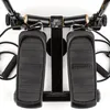 A close-up, top-down view of a stepper machine with resistance bands. Voir les images du produit