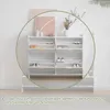 A white shoe cabinet with multiple shelves is shown in a room with a white wall and a light gray rug. Produktbild-Vorschau