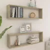 Two wooden cube shelves mounted on a white wall, decorated with books, picture frames, vases, and a decorative sphere. Produktbild-Vorschau