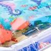 A close-up of an interactive inflatable water mat for children, featuring a colorful sea world theme with various sea creatures and aquatic elements. Podgląd zdjęcia produktu