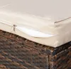 A close-up view of a cushion on a wicker furniture set. Náhled obrázku produktu