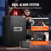 A safe with a flashing red light on top, and a burglar in the background. Inset images show alarm features. Anteprima dell’immagine prodotto