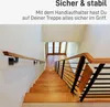 A wooden staircase with black metal railings and wooden handrails, viewed from above. Náhľad obrázku produktu