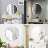 A collage of four images showing round LED bathroom mirrors in different settings. Produktbild-Vorschau