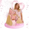 Paris Hilton posing with a pink knife set and heart-shaped blocks, surrounded by pink confetti and heart balloons. Produktbild-Vorschau