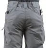A close-up view of the back of gray tactical pants, showing pockets and belt loops. Náhled obrázku produktu