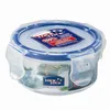 A round LocknLock food storage container with a blue lid and clear body, filled with some food items. Voir les images du produit