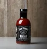 A bottle of Jack Daniels Original BBQ Sauce against a wooden background. Produktbild-Vorschau