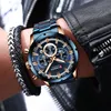 A close-up shot of a man's wrist wearing a blue and gold chronograph watch, with a black leather jacket and bracelets visible. Produktbild-Vorschau