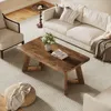 A living room scene with a couch, armchair, coffee table, and rug. Podgląd zdjęcia produktu