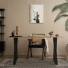 A modern home office setup with a wooden desk, chair, and decorative items. Náhľad obrázku produktu