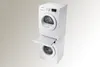 A stacked washing machine and dryer unit with a pull-out shelf between them. Voir les images du produit