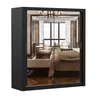 A mirrored wardrobe with a reflection of a bedroom interior. Produktbild-Vorschau