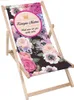 A floral-patterned deck chair with text and a crown graphic. Produktbild-Vorschau