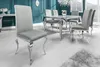 A dining room set with a table and chairs. Náhled obrázku produktu