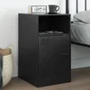 A black bedside table with a shelf and a cabinet door, placed next to a bed. Produktbild-Vorschau