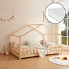 A child's bed with a house-shaped frame, decorated with stuffed animals and pillows, in a bedroom setting. Náhľad obrázku produktu