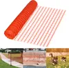 A collage of images showing orange safety netting, including a roll of the netting, a section of netting used as a fence, and a section of netting in a grassy area with two cats. Náhled obrázku produktu