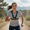 A woman is running on a dirt path in a natural outdoor setting. Náhľad obrázku produktu