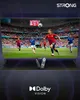 A television displaying a soccer match, with two remote controls in the foreground and Dolby Vision branding at the bottom. Náhled obrázku produktu