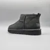 A single gray Ugg boot is shown against a plain gray background. Voir les images du produit