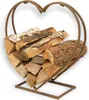 A heart-shaped metal log holder filled with firewood, presented against a white background. Produktbild-Vorschau