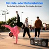 A group of people are in an outdoor skate park, with one person breakdancing and a boombox in the foreground. Produktbild-Vorschau