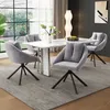 A dining room set with a marble-top table and four grey upholstered chairs. Podgląd zdjęcia produktu