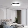 A bedroom with a bed, curtains, and a ceiling light. Produktbild-Vorschau