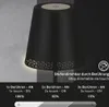 A black table lamp with a perforated base is shown against a textured gray background. The image includes text and graphics explaining its dimming features. Produktbild-Vorschau