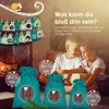 Two children are looking at each other with a fireplace and Christmas decorations in the background. Several small bags with numbers are hanging on a line. Produktbild-Vorschau