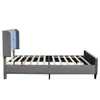 Side view of a gray upholstered bed frame with a slatted mattress support and blue LED lighting in the headboard. Náhľad obrázku produktu