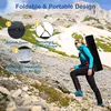 A woman hiking up a rocky slope carrying a long black bag. Produktbild-Vorschau