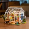 A miniature greenhouse model with furniture and plants. Anteprima dell’immagine prodotto