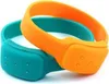 Two silicone wristbands, one teal and one orange, are shown overlapping against a white background. Podgląd zdjęcia produktu