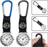 A collage of images showing a carabiner watch with a compass, and a close-up of a carabiner clip. Produktbild-Vorschau